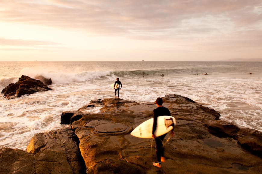 Surfing in Peru at sunset
