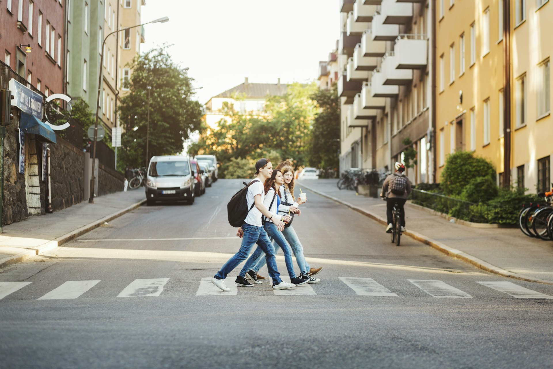 Teenagers cross the street in Stockholm