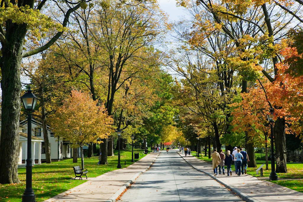 People Strolling on Sidewalk Through Neighborhood People Strolling on Sidewalk Through Neighborhood