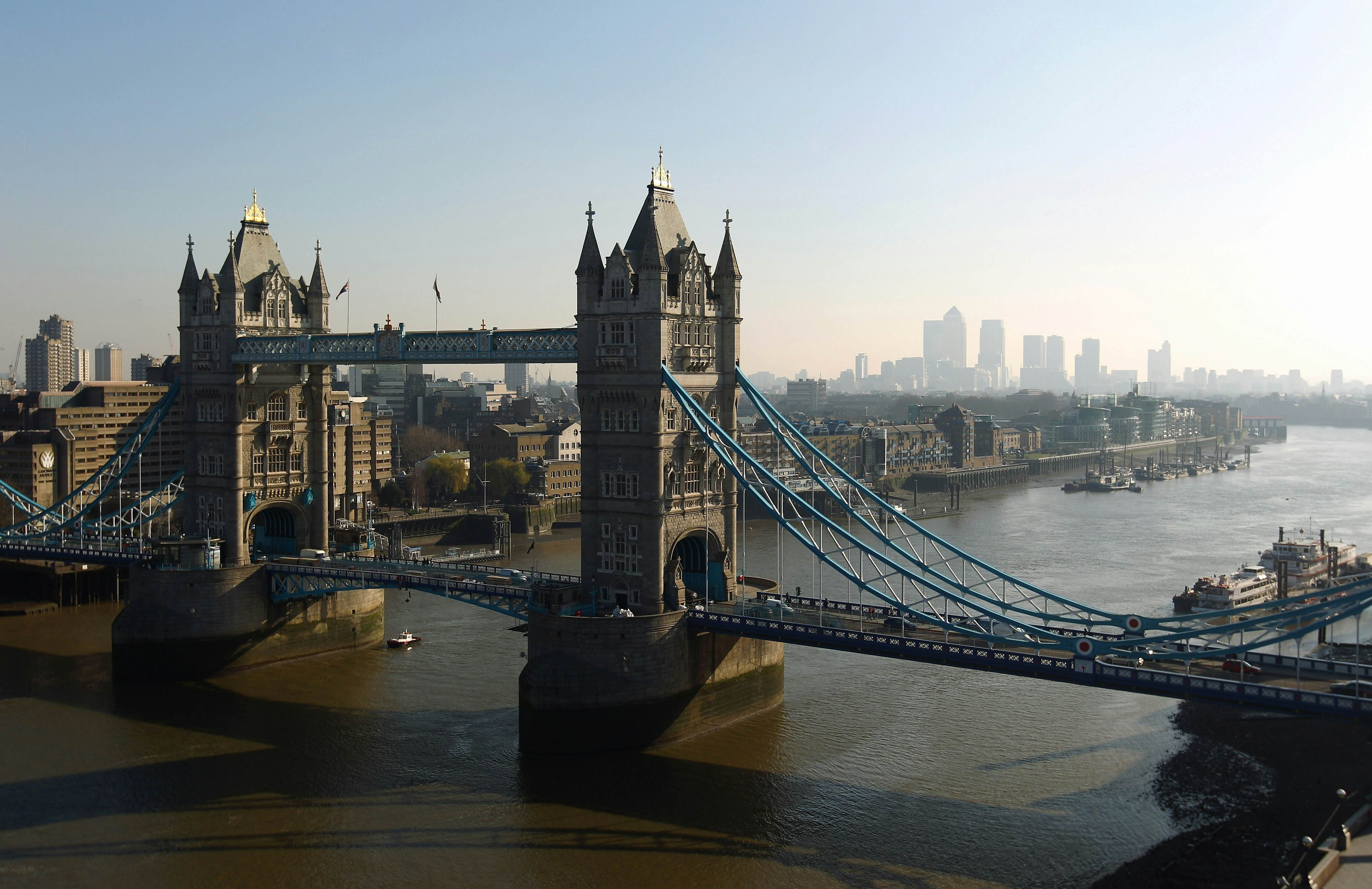 LONDON, ENGLAND - MARCH 07:  Tower Bridge with Canary Wharf in the distance viewed from the top of City Hall on March 7, 2011 in London, England.  