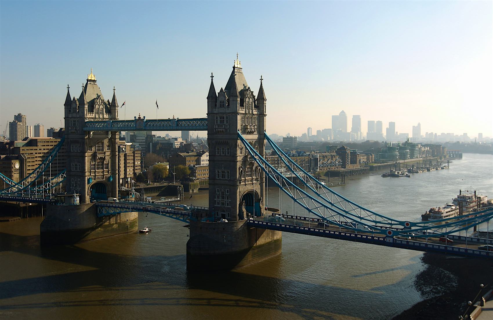 LONDON, ENGLAND - MARCH 07: Tower Bridge with Canary Wharf in the distance viewed from the top of City Hall on March 7, 2011 in London, England.
