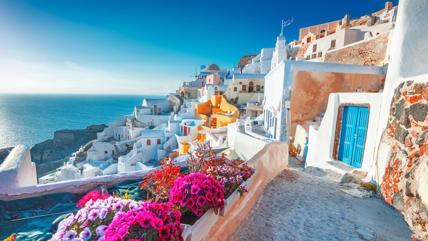 Enjoy a hike past cycladic Santorini houses in Oia village