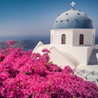 Blue dome church at Imerovigli village at Santorini, Greece