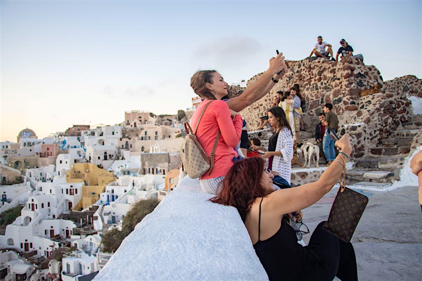 Santorini, Greece Tourists taking selfies on Santorini Island
