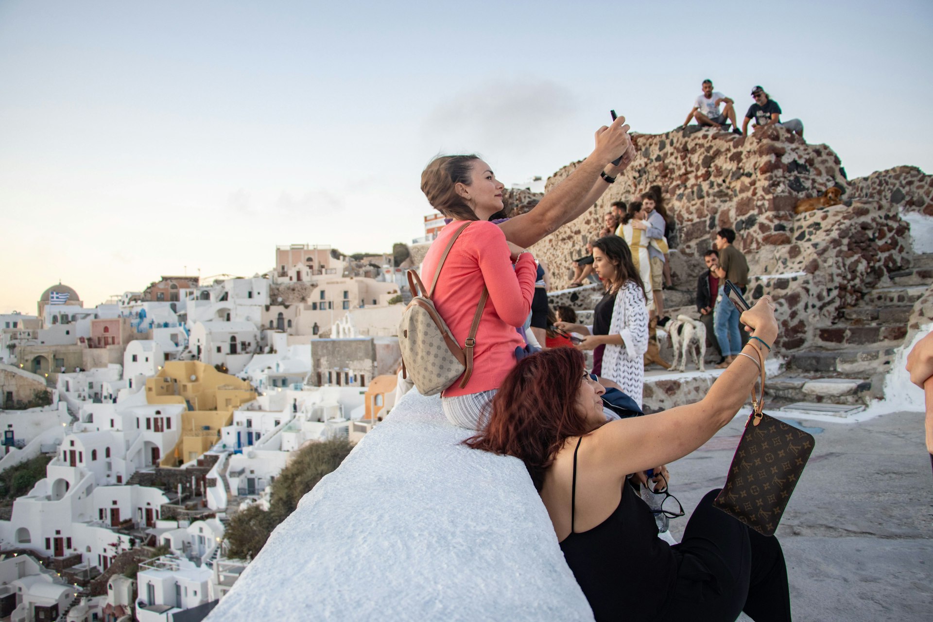 Tourists taking selfies on Santorini Island