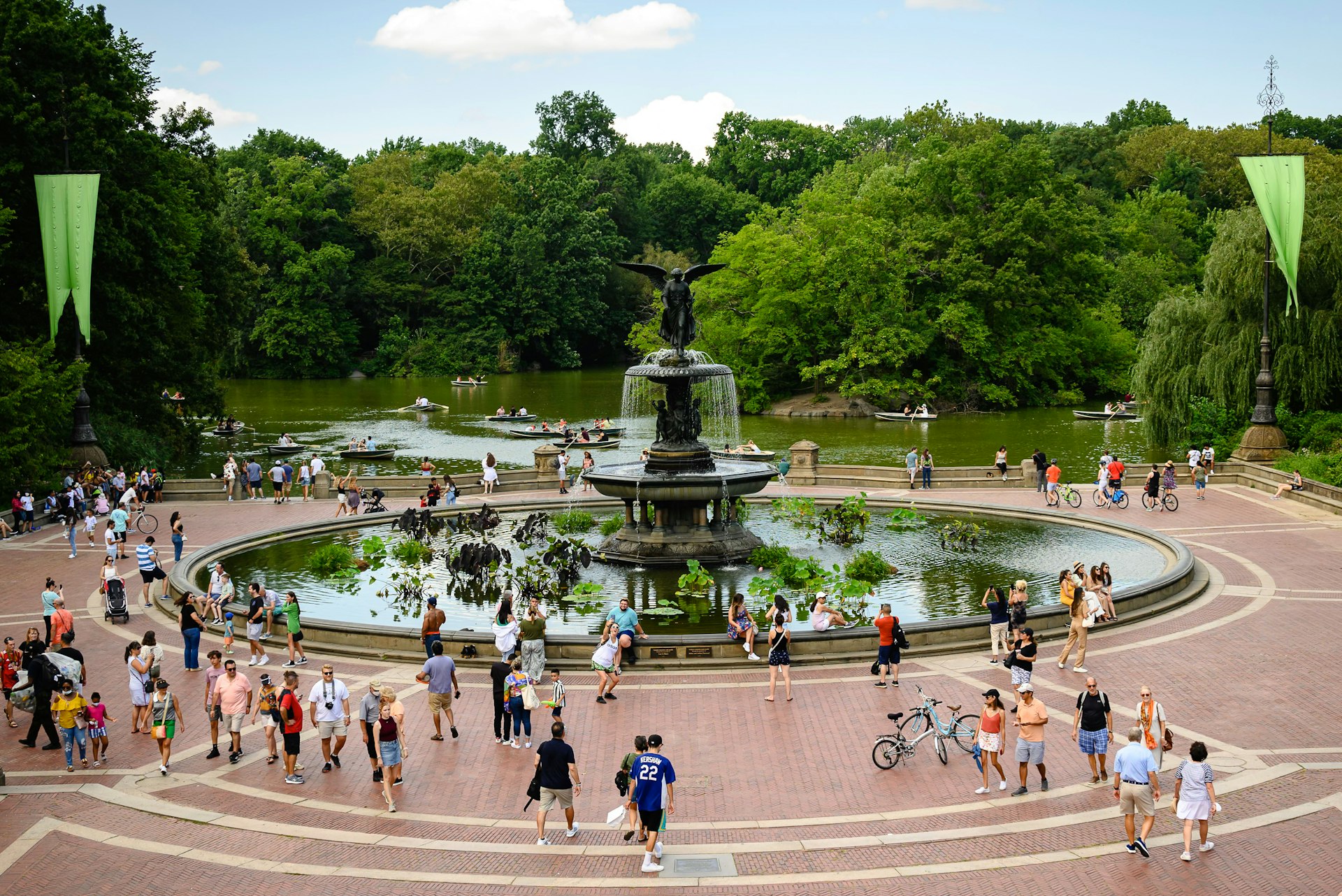 People mill around the ornate Bethesda Fountain in Central Park. 