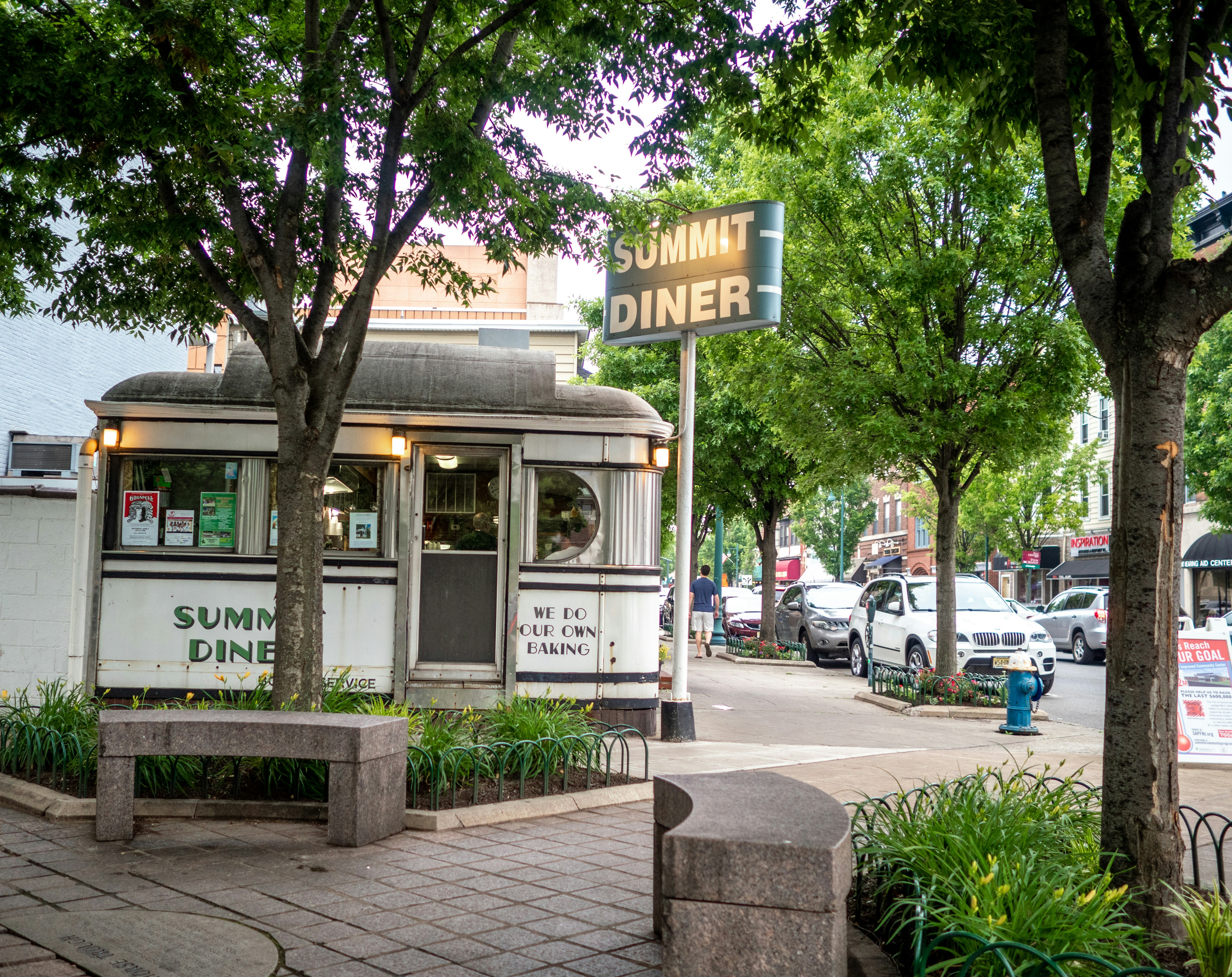 the exterior of an old fashioned diner restaurant in a small suburban town in North America