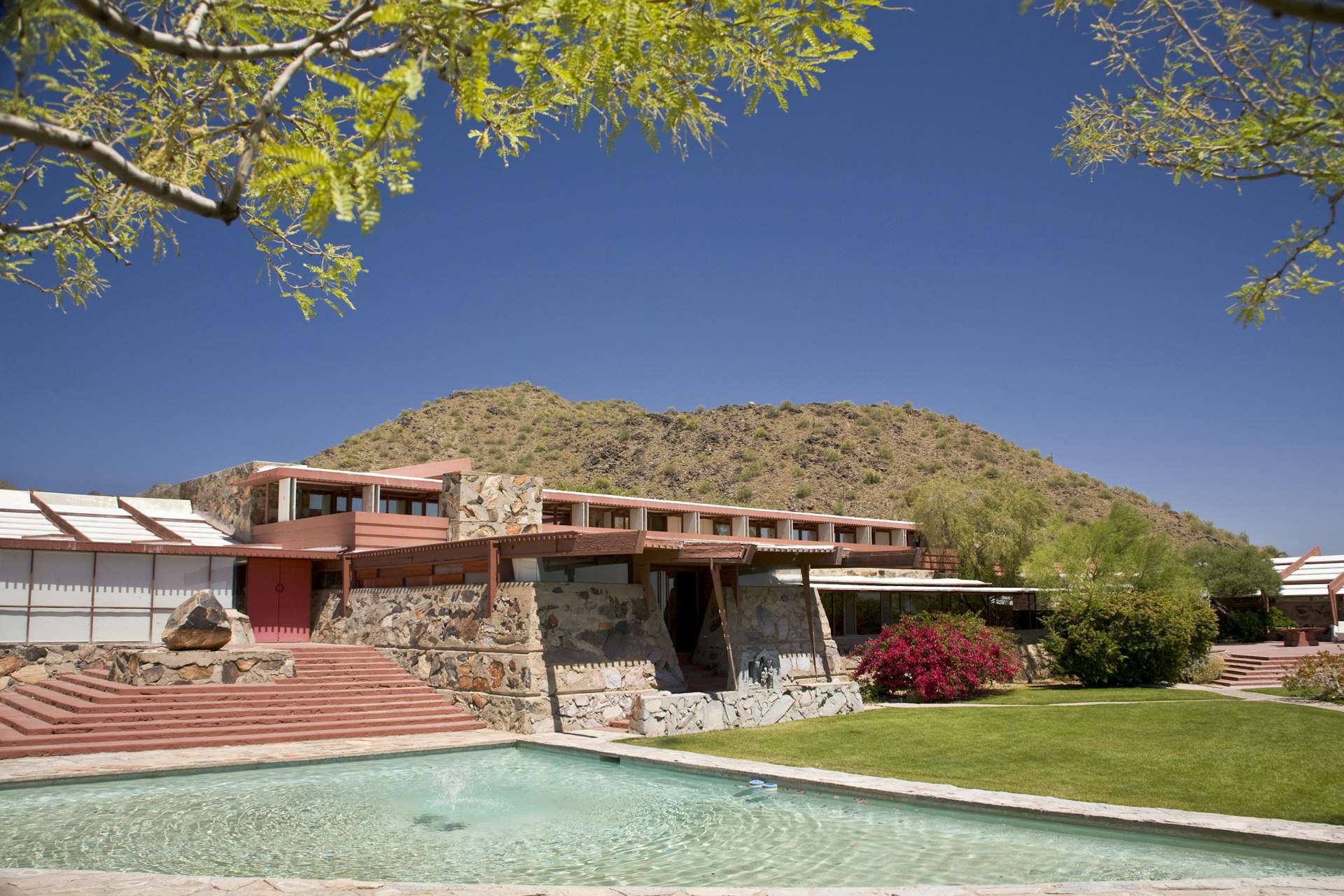 The Frank Lloyd Wright–designed architecture of Taliesin West under a blue sky in Scottsdale