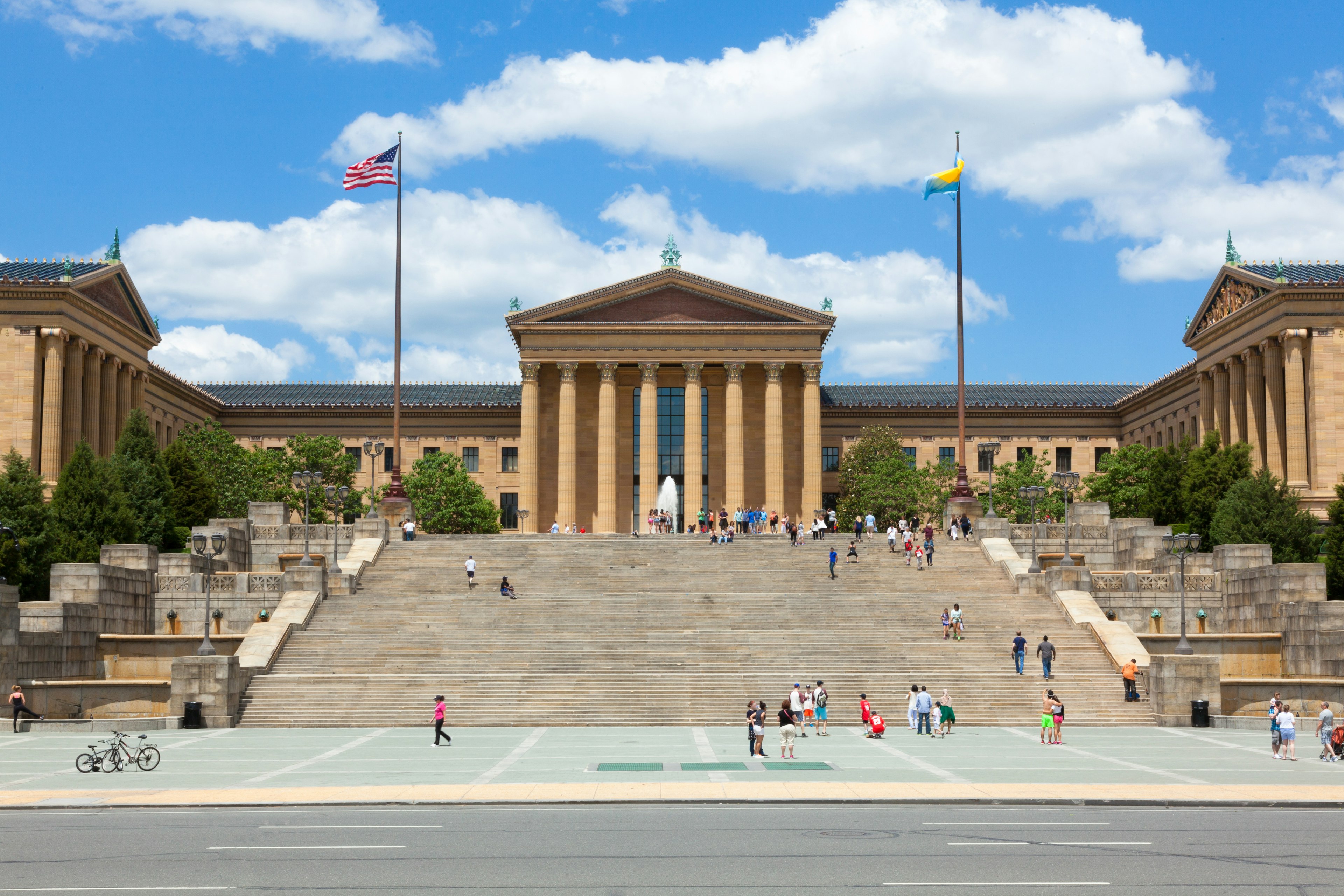 People sitting and walking on the steps to the Philadelphia Museum of Art, made famous in the Rocky movie