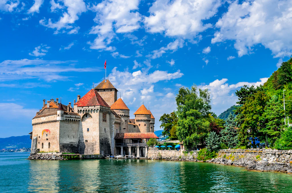 shutterstockRF_281953322.jpg A view of the exterior of Castle Chillon, one of the most visited castles in Switzerland. The structure stands on a rock jutting out into Lake Geneva, and its high walls are surrounded by water on most sides.