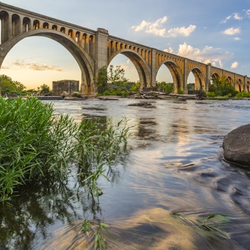 This concrete arch railroad bridge spanning the James River was built by the Atlantic Coast Line, Fredericksburg and Potomac Railroad in 1919 to route transportation of freight around Richmond, VA.