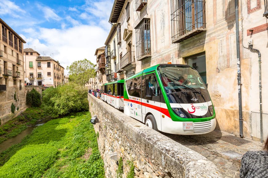 Granada City Tour with the shuttle bus along the Carrera del Darro in the Albayzin quarter