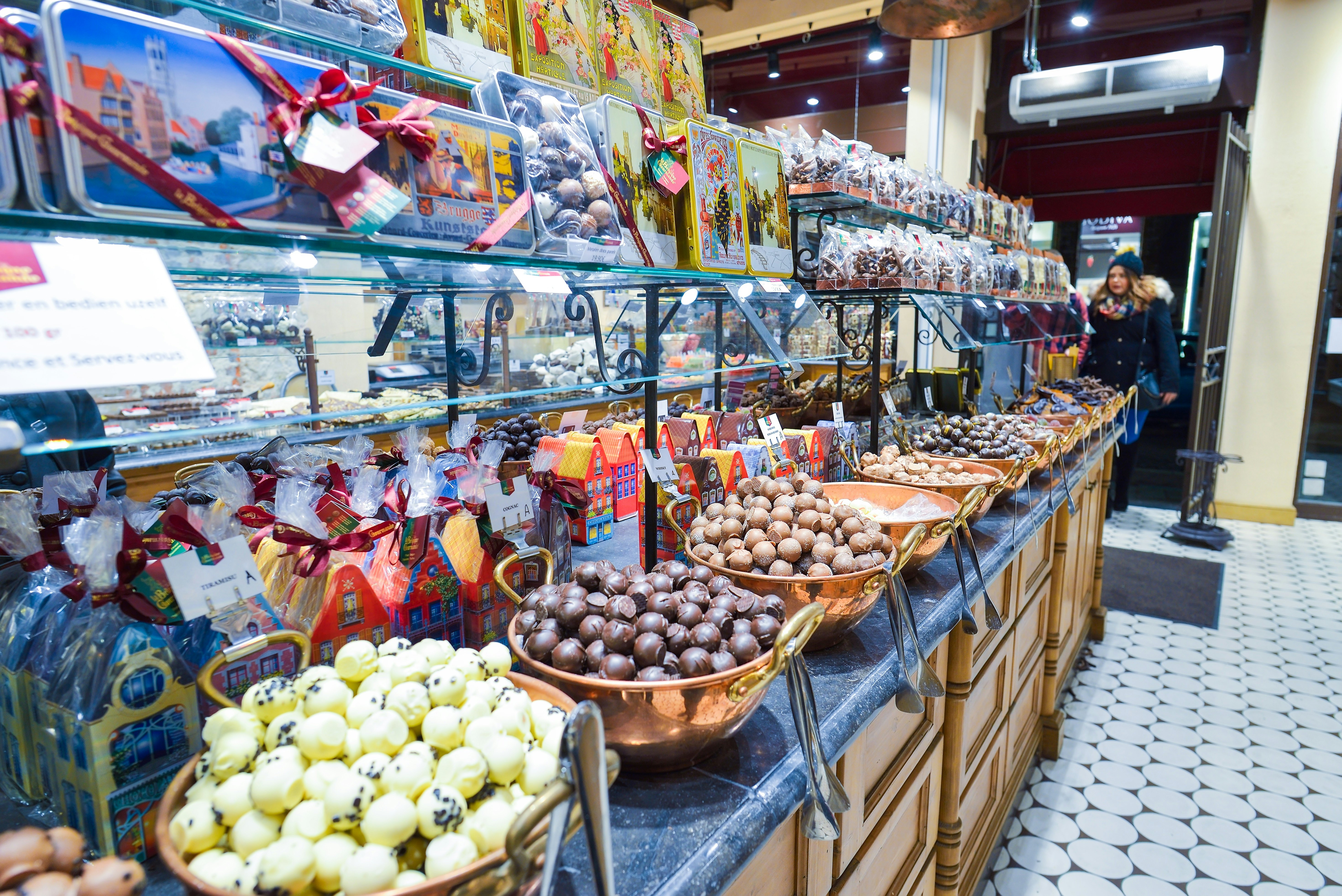 Interior shot of a chocolate shop with a variety of sweets and belgian chocolate