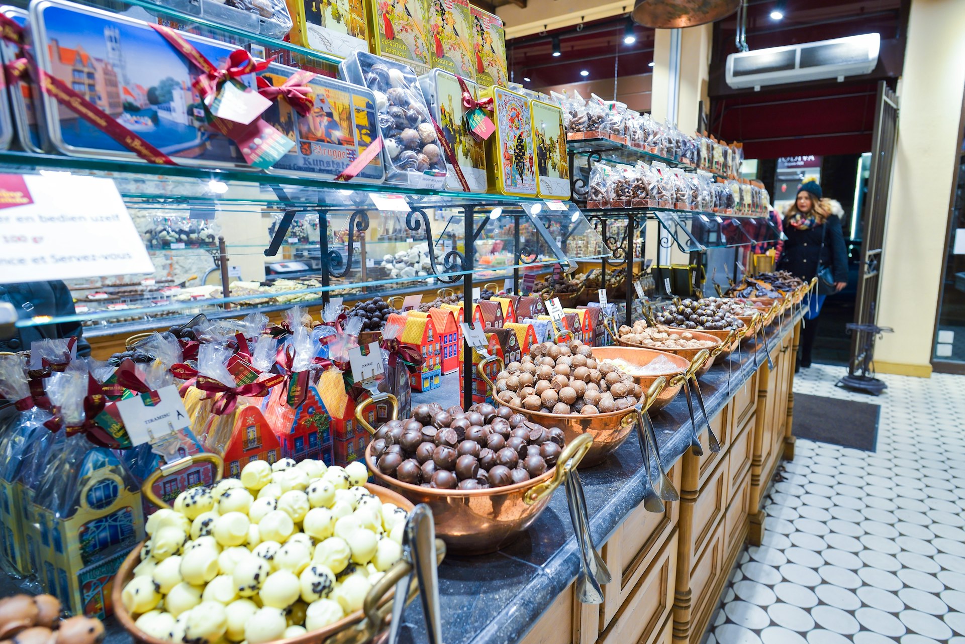 Interior shot of a chocolate shop with a variety of sweets and belgian chocolate