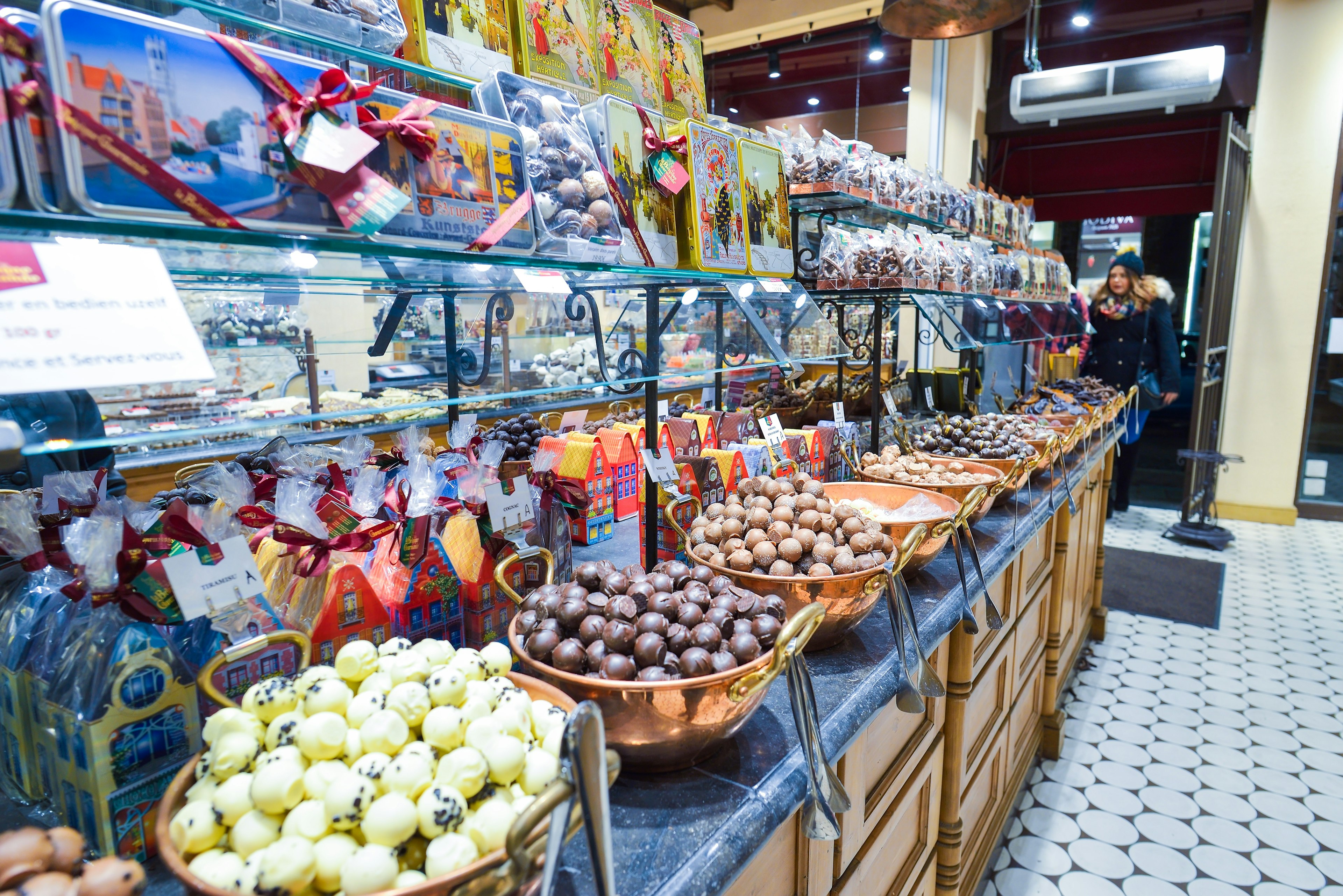 Interior shot of a chocolate shop with a variety of sweets and belgian chocolate