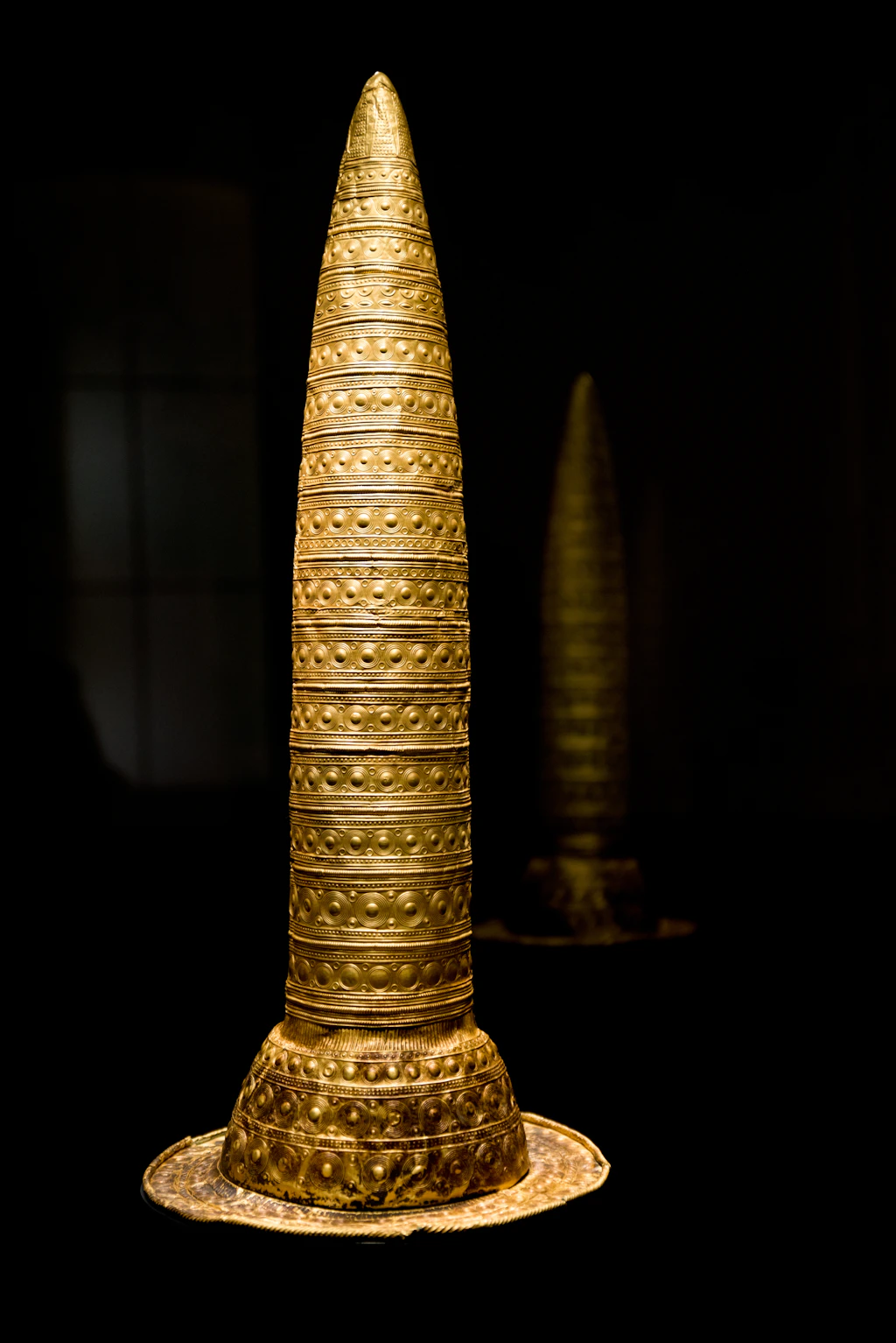 Bronze Age golden hat, Neues Museum Very tall, narrow hat made of gold in a display cabinet