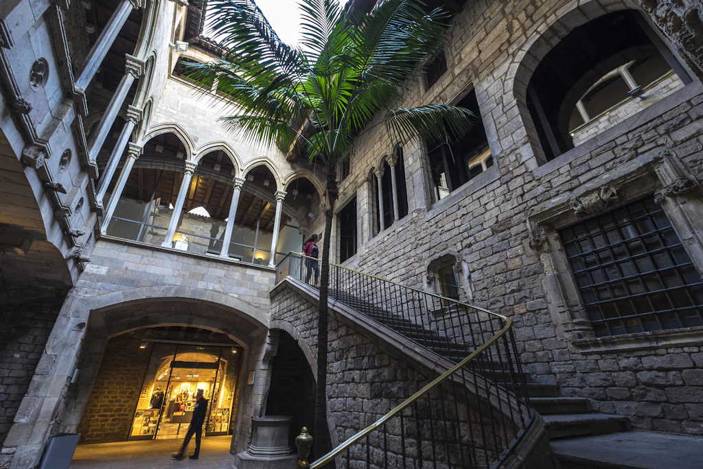 shutterstockRF_675068251.jpg Entrance to the Museu Picasso Museum in the Born Quarter. The museum is housed in a number of former palaces, which are very grand, with wide staircases and open courtyards.