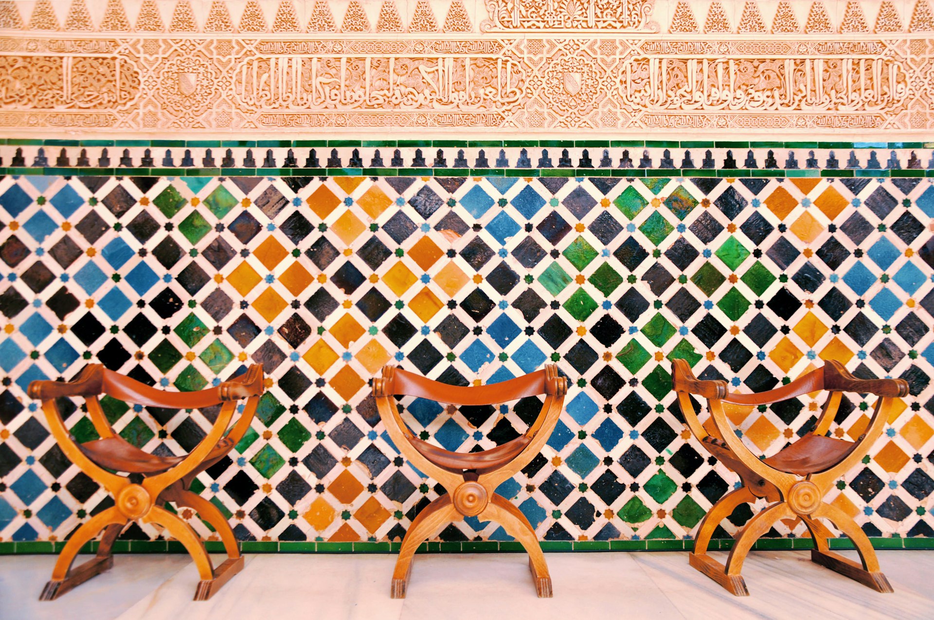 Colourful tiled wall in the courtyard of the palace of Alhambra, Granada
