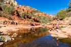 Coconino, AZ USA - October 17, 2016: Visitors enjoying the beauty of Slide Rock State Park with its natural rock water slides in the Oak Creek Canyon near Sedona.; Shutterstock ID 619981541; your: Tasmin Waby; gl: 65050; netsuite: Online Editorial; full: Demand Project