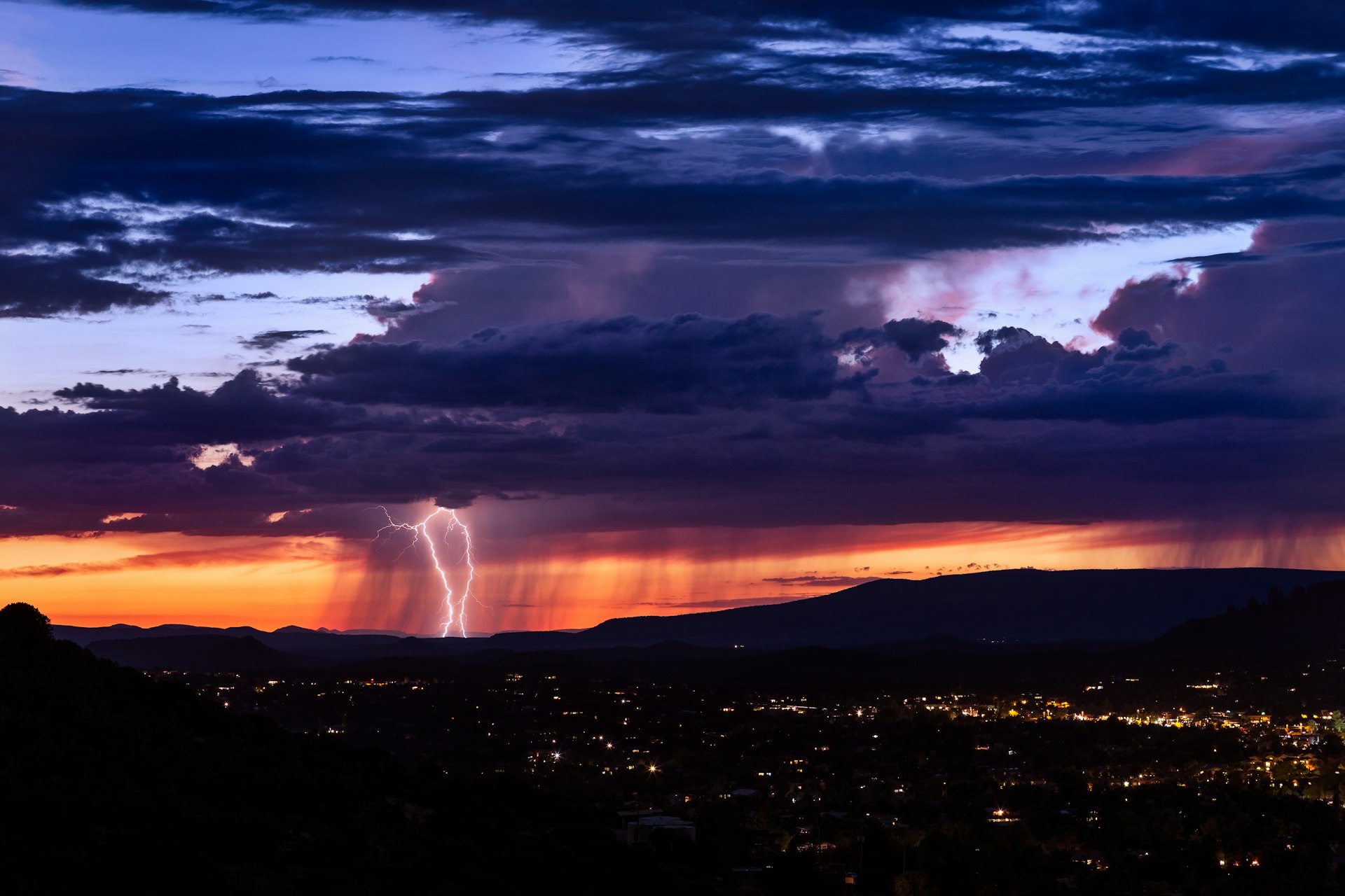 Thunderstorm with lightning bolt strike over Sedona, Arizona.