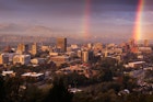 USA, North Carolina, Asheville, elevated city skyline with rainbows, dawn.
