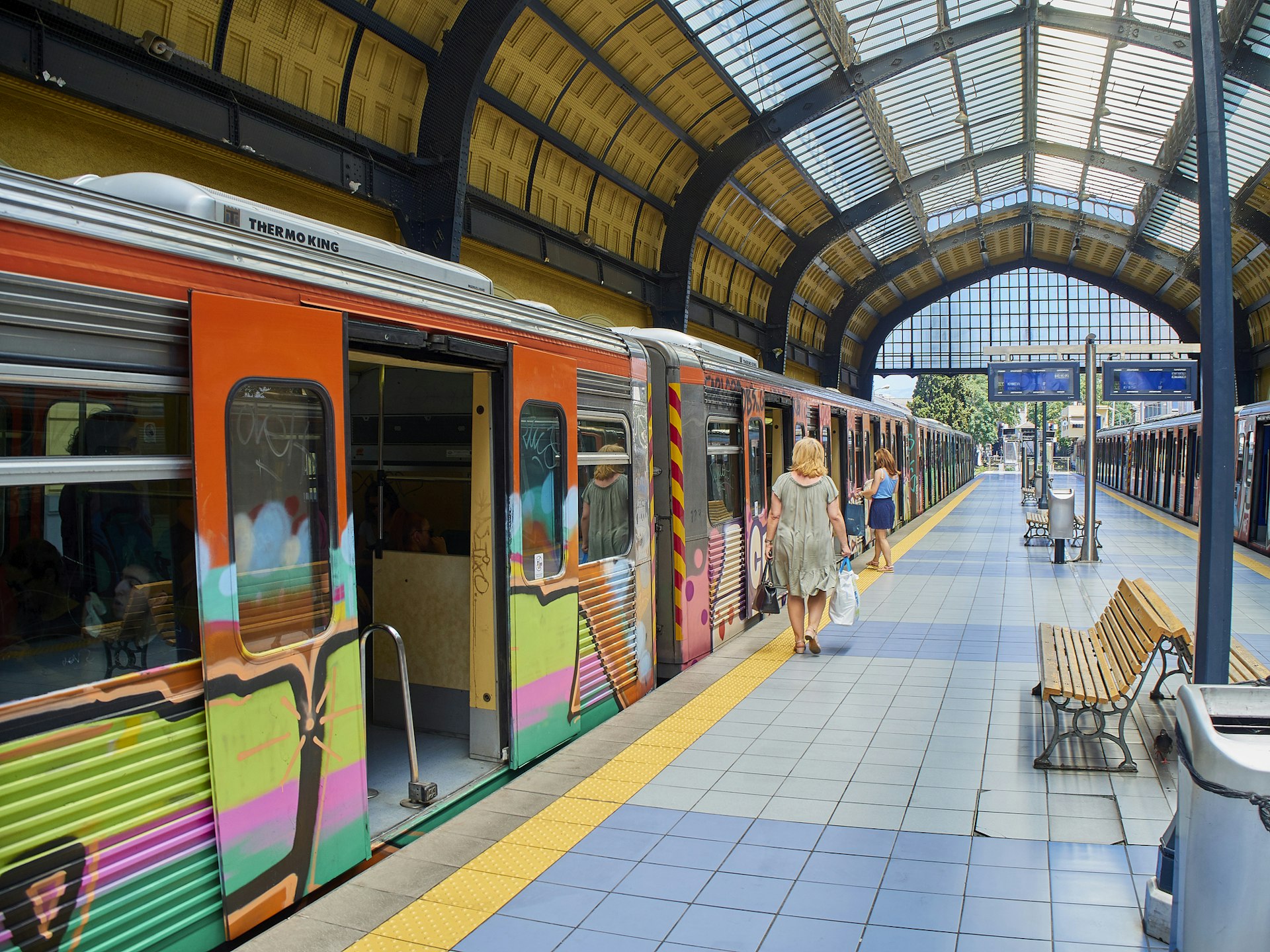 A colorful train waiting at the platform in Piraeus Metro station. Athens