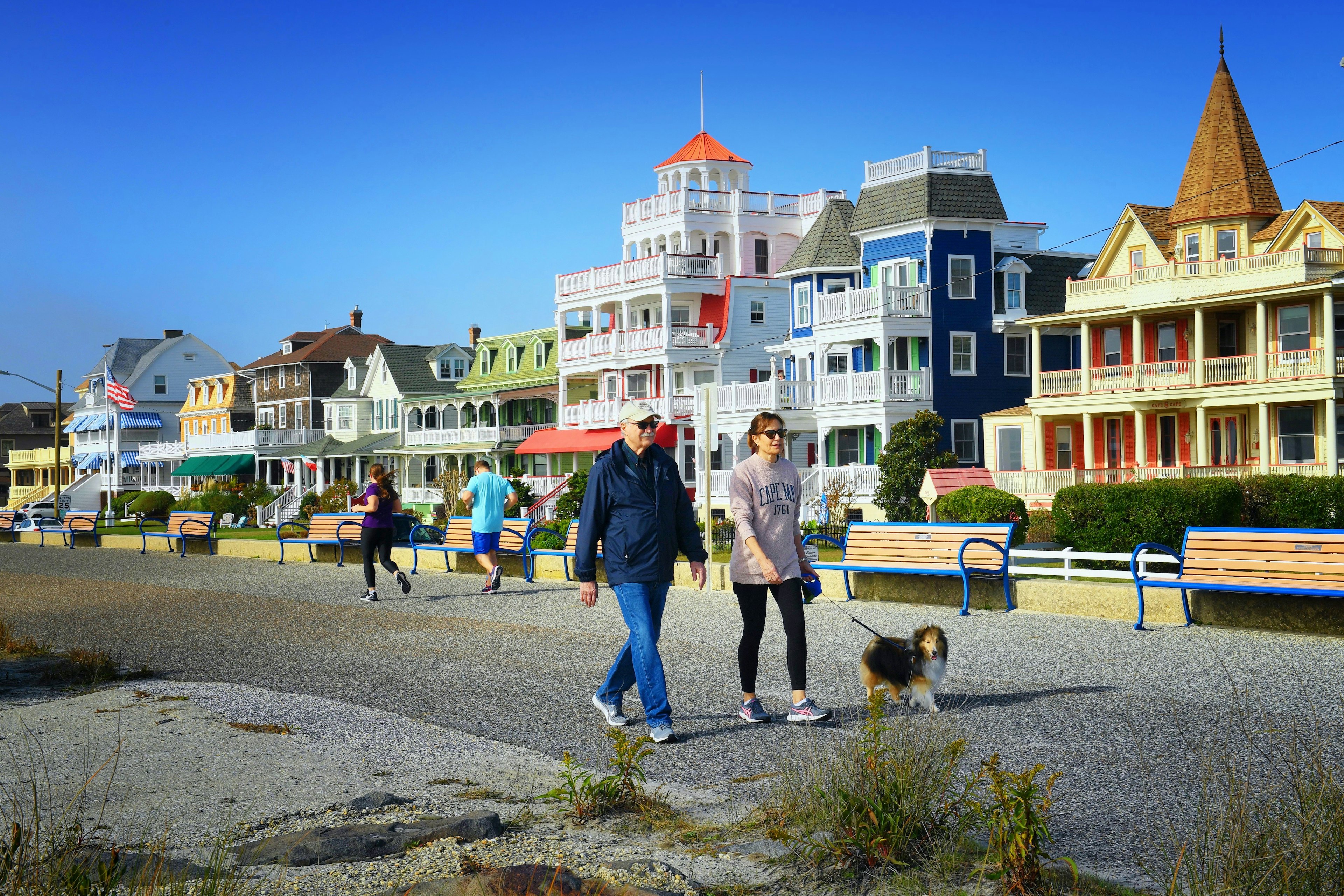 People walking on a path in front of Victorian houses in Cape May, Virginia