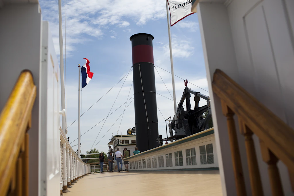 Visitors tour the promenade deck on the 220-foot steamboat "Ticonderoga," the last remaining paddlewheel passenger steamboat in the USA, at the Shelburne Museum