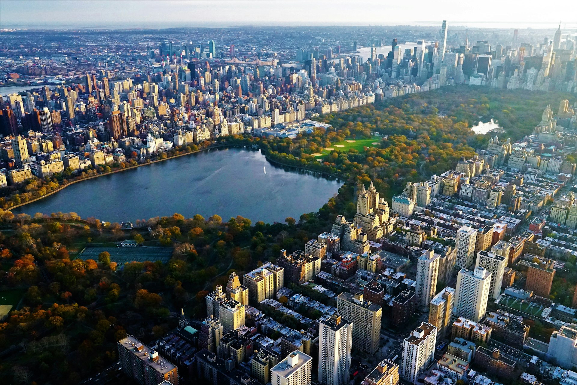 Aerial view of Central Park in Manhattan with the reservoir in foreground. You can spot the iconic Guggenheim Museum on the opposite side of the reservoir. 