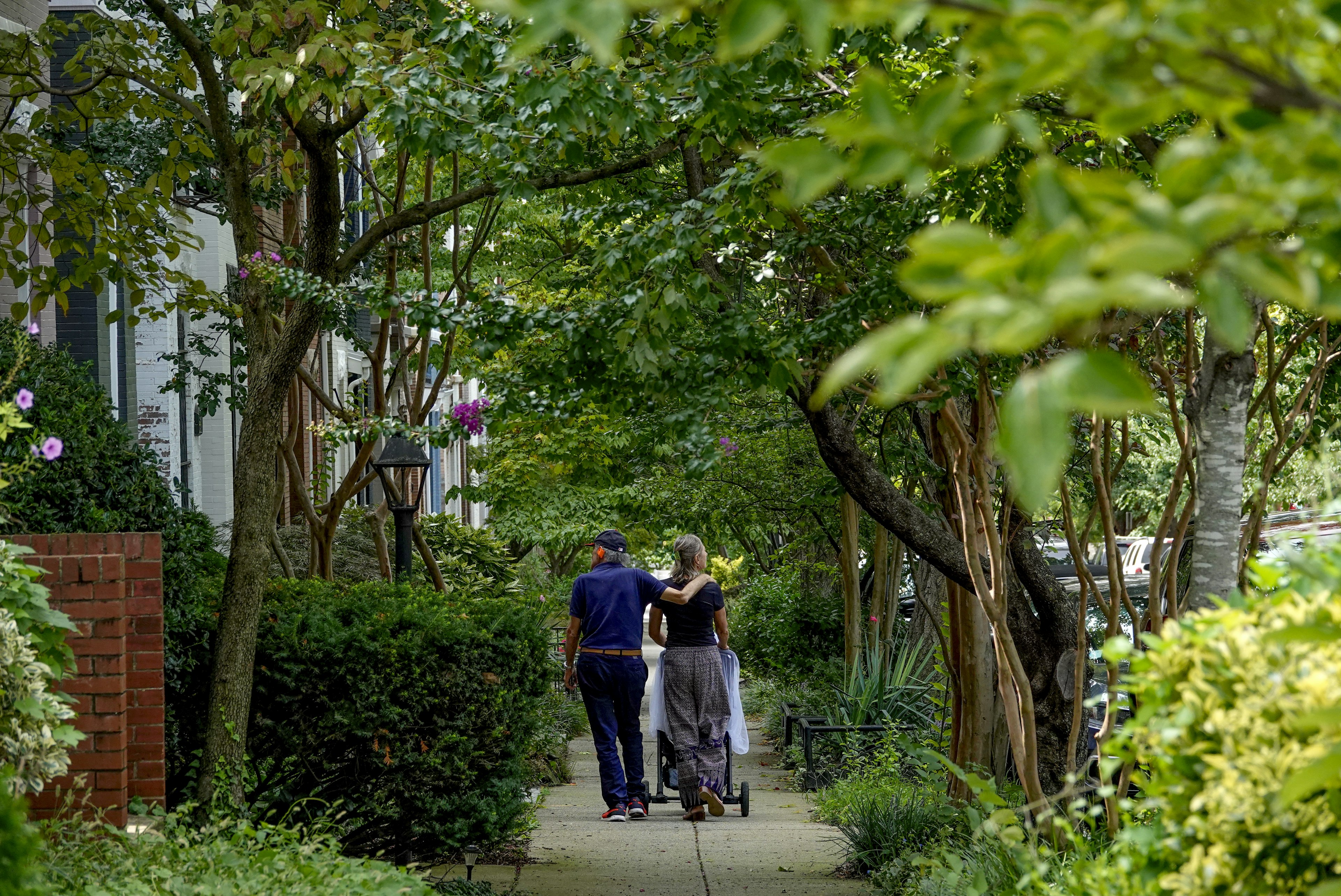 An older couple strolls through DC's Bloomingdale neighborhood