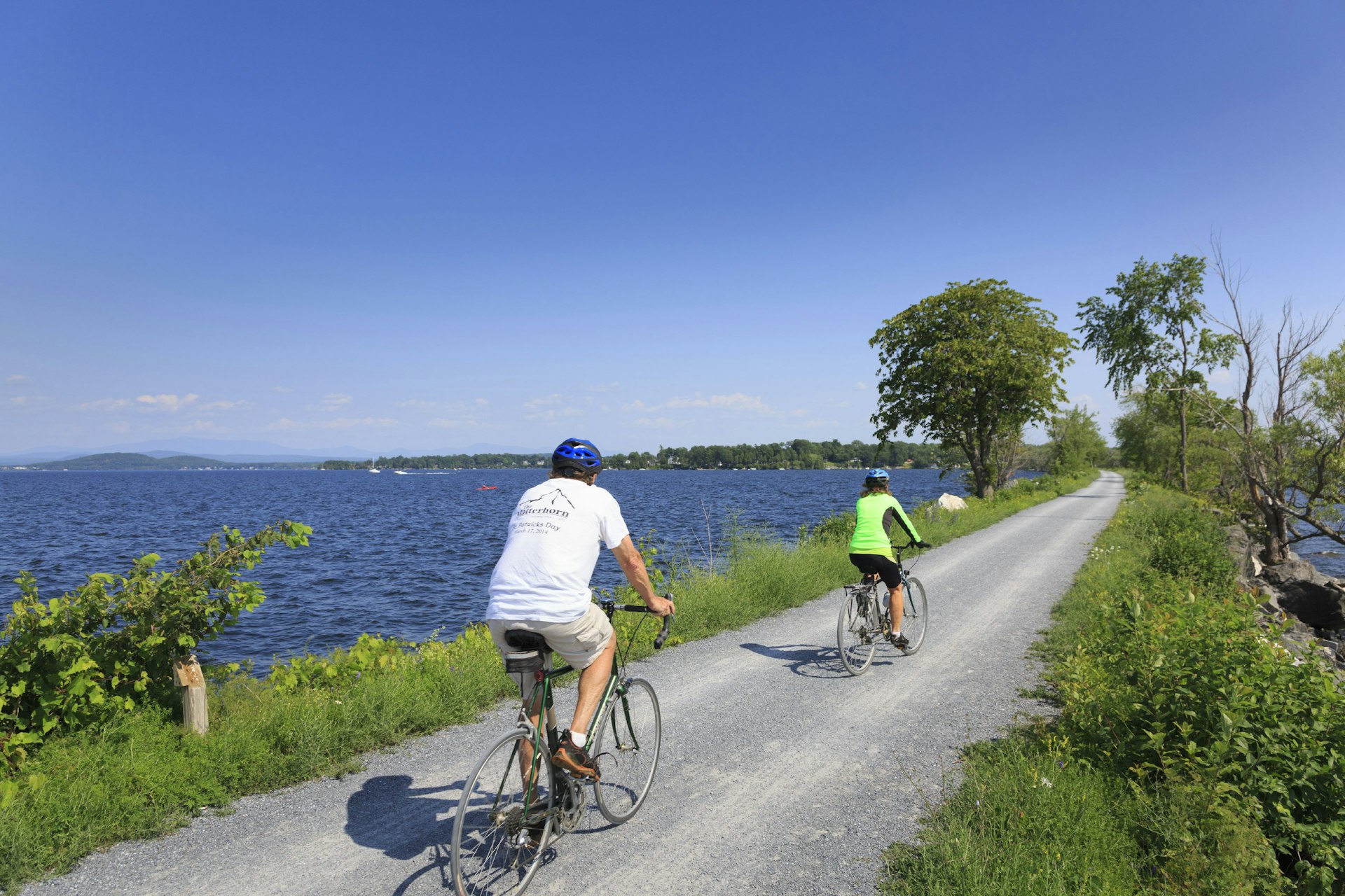 Cyclists ride on the Colchester Causeway on Lake Champlain in Vermont