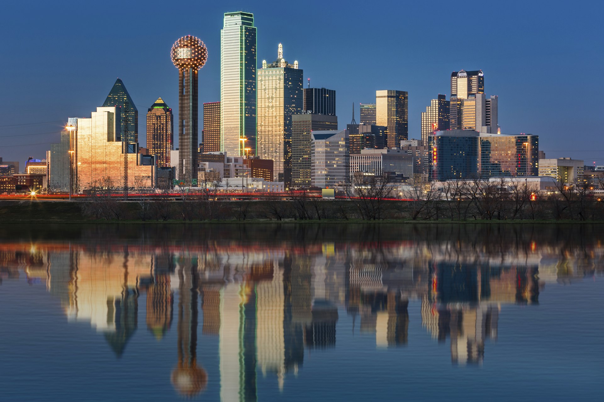 The Dallas skyline at sunset with skyscrapers gleaming