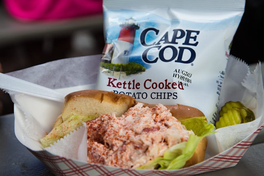  A lobster roll, pickle and bag of local potato chips in Cape Cod 