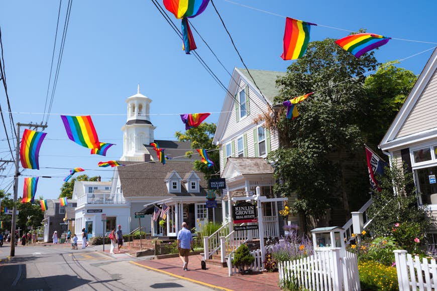 People meandering about Commercial Street in Provincetown during the daytime. 