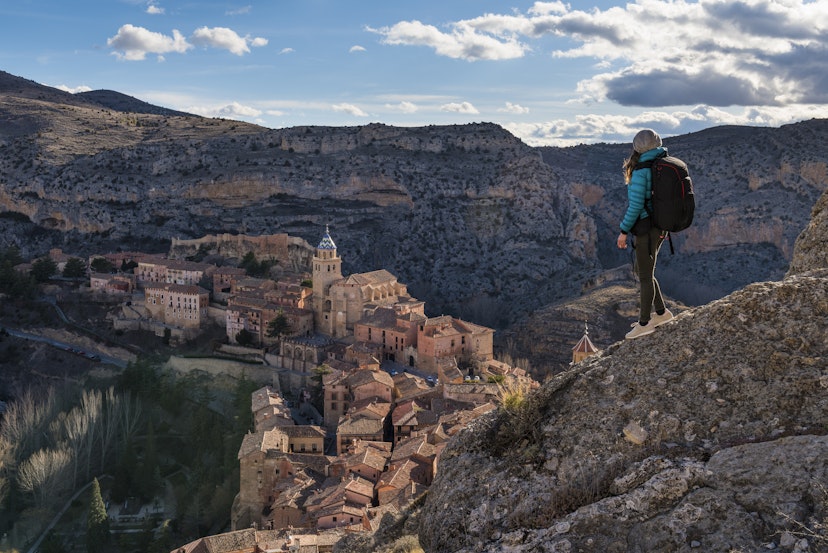 A hiker admires the view of Albarracin. Albarracin, Teruel, Aragon, Spain