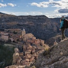 A hiker admires the view of Albarracin. Albarracin, Teruel, Aragon, Spain
