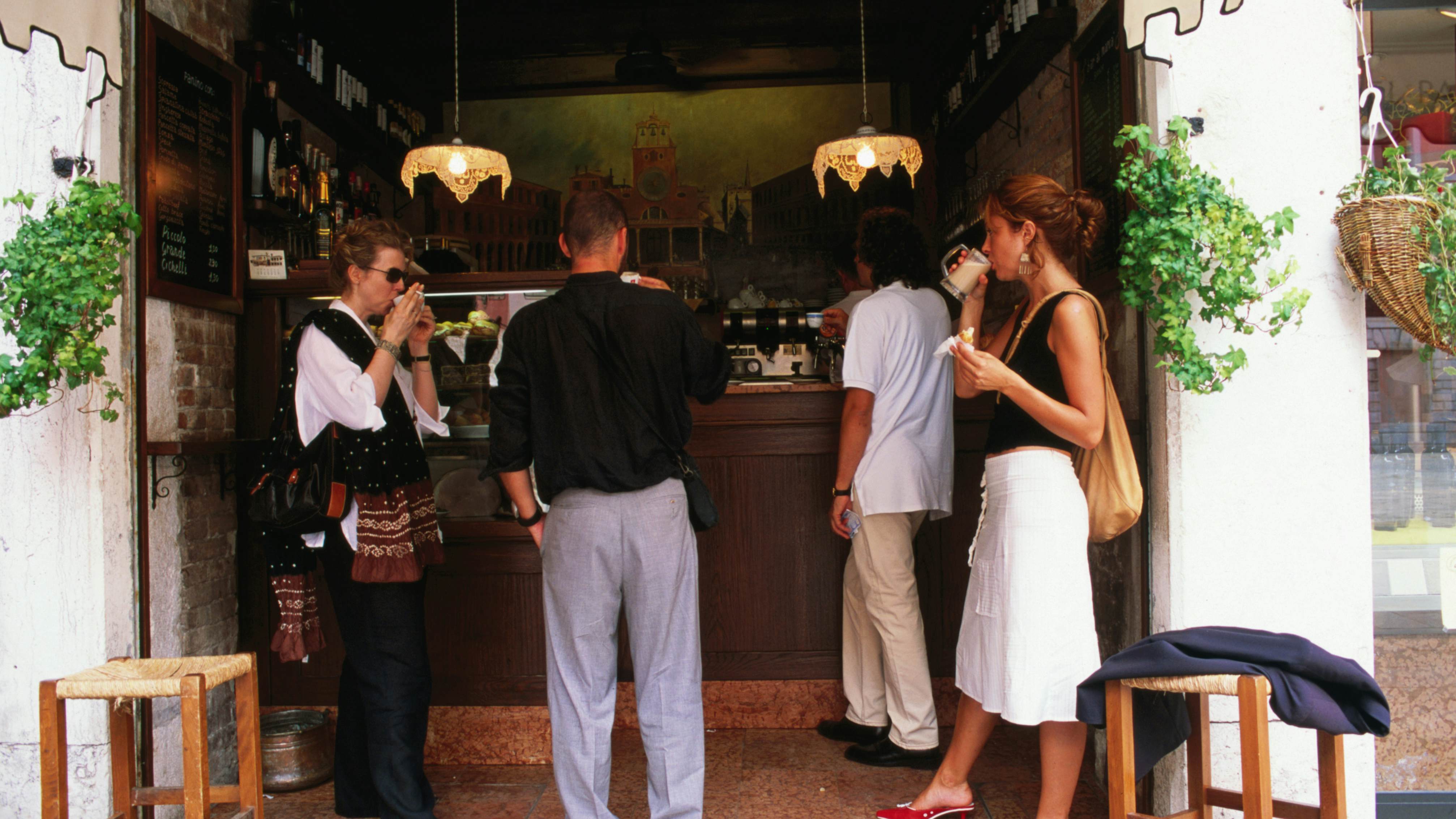 Locals take a standing coffee at Al Marca cafe.