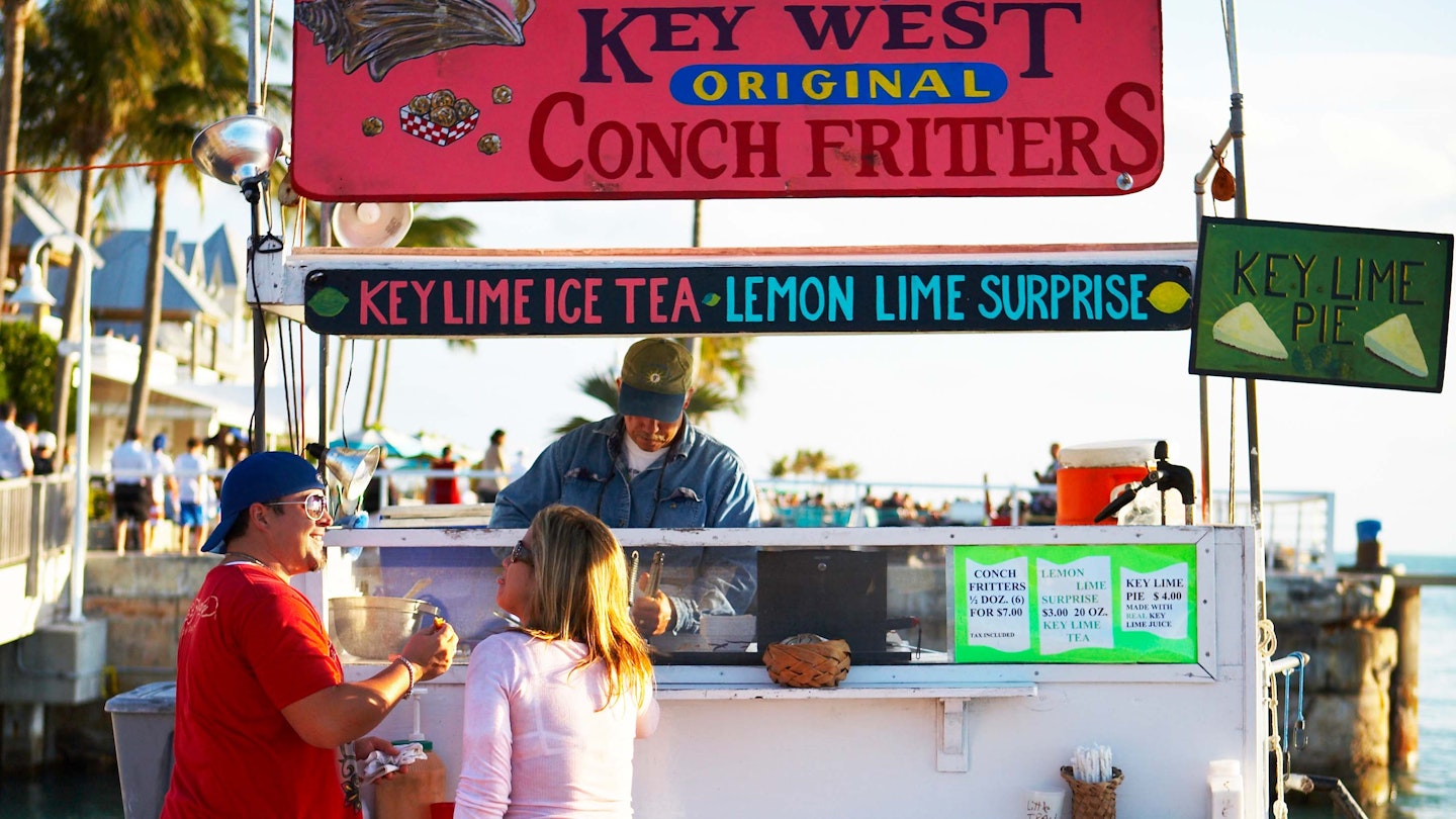 Tourists at conch fritter stand on Mallory Square