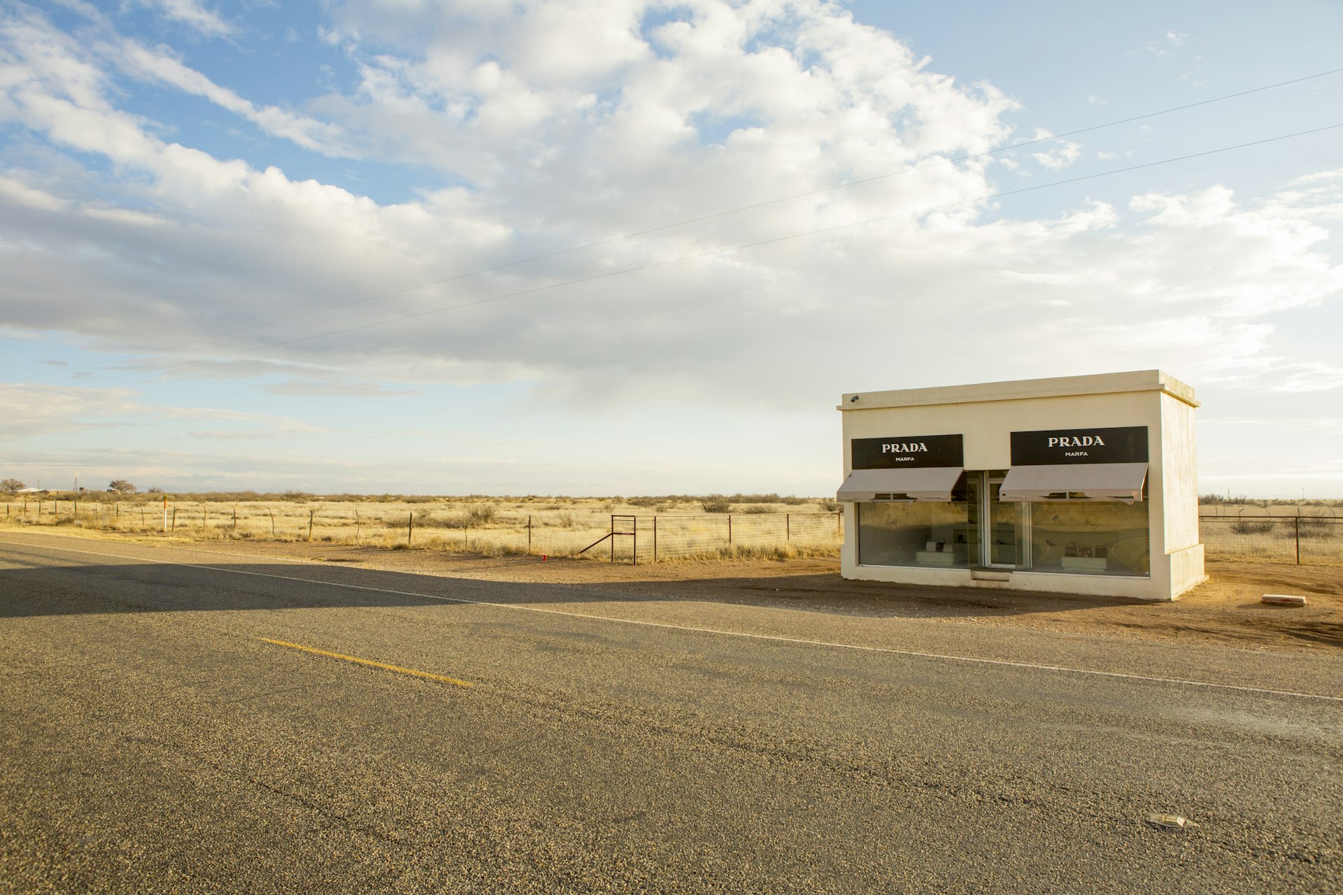 Prada Marfa, a permanently installed sculpture by artists Elmgreen and Dragset, situated 1.4 miles (2.3 km) northwest of Valentine, Texas, just off U.S. Highway 90 (US 90), and about 26 miles (42 km) northwest of the city of Marfa. 