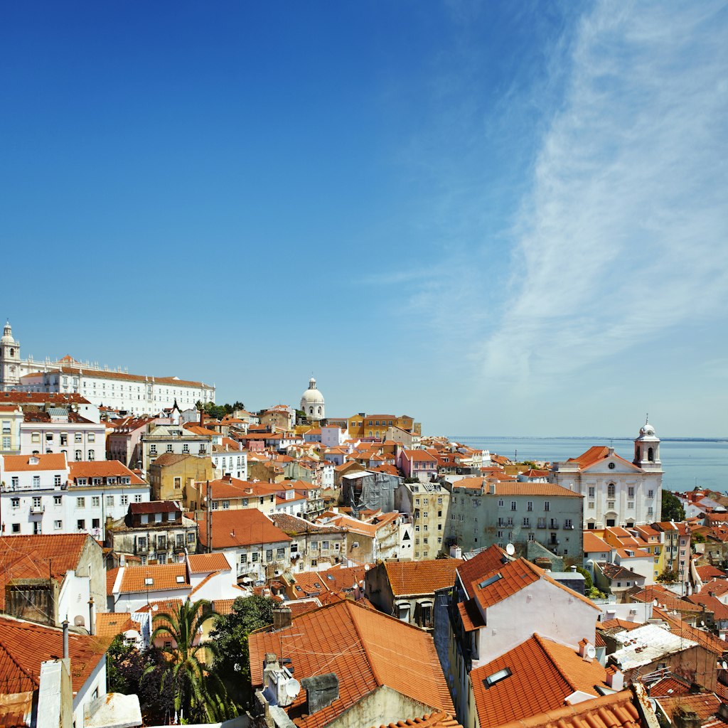 Overview of Alfama district beside Tagus River estuary.