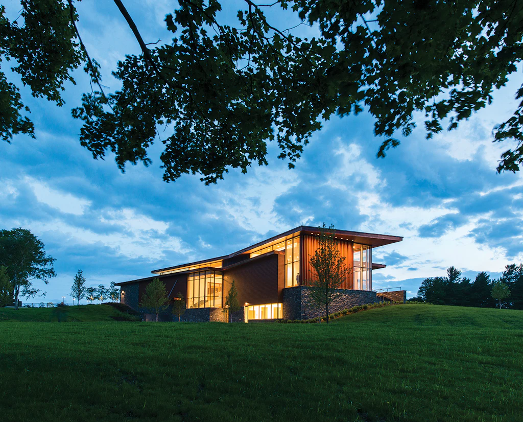 The modern-looking Pizzagalli Center for Art and Education building at Shelburne Museum. The building is constructed from wood with large glass windows.