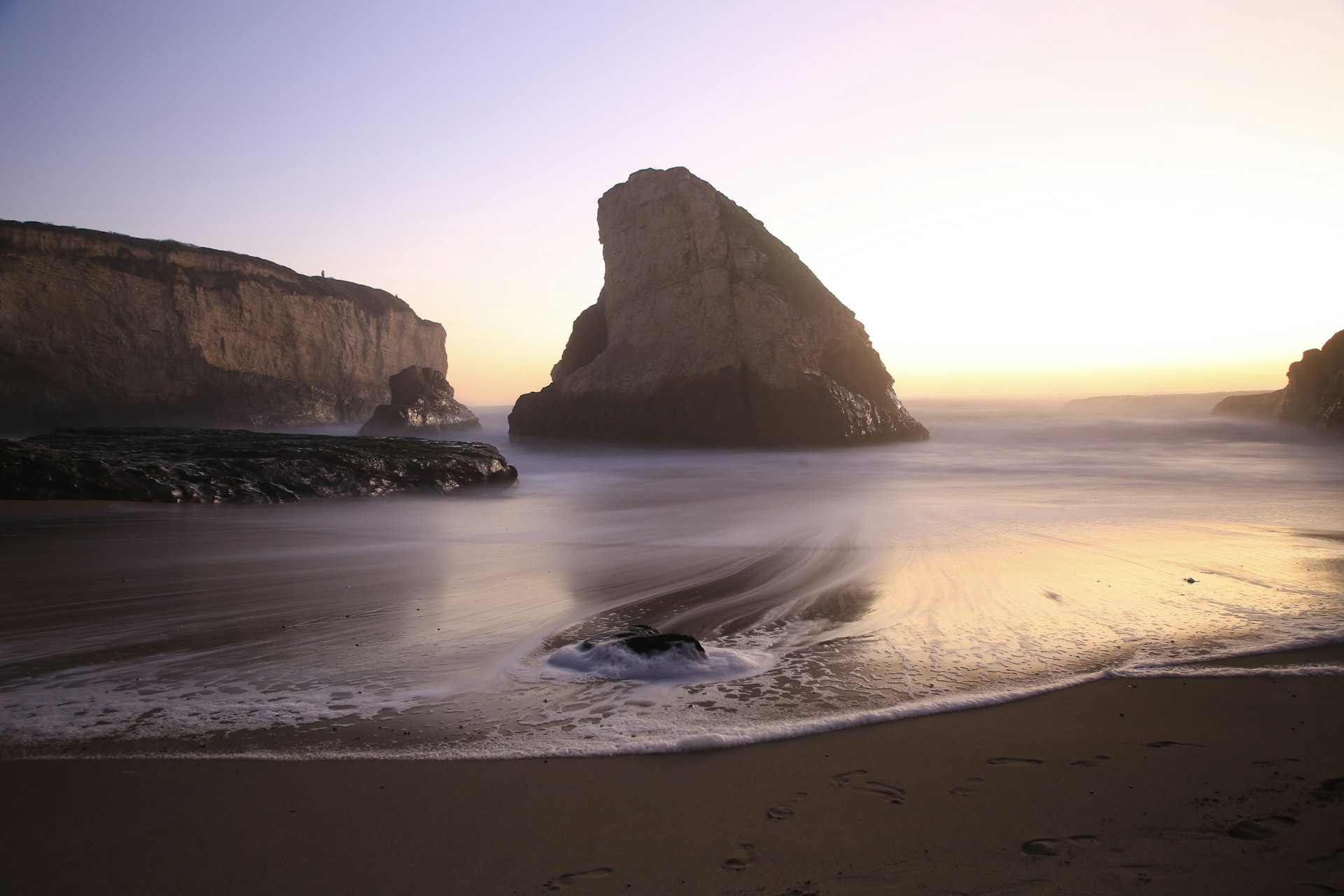 The distinctive shark-fin-shaped rock jutting out of the ocean at Shark Fin Cove