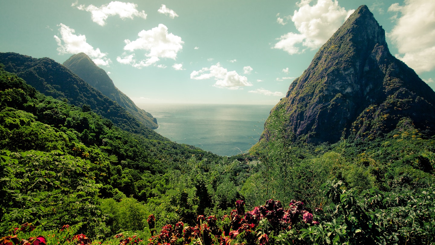 Beautiful rain forest surrounding the lake and the mountain peeks in this Caribbean paradise