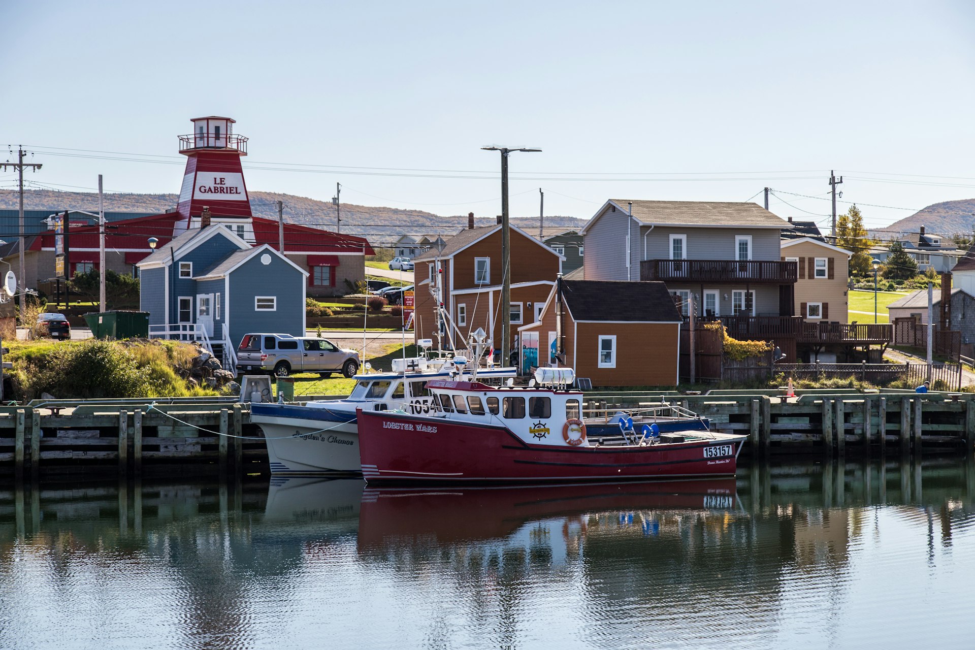 Boats in a harbor with calm water