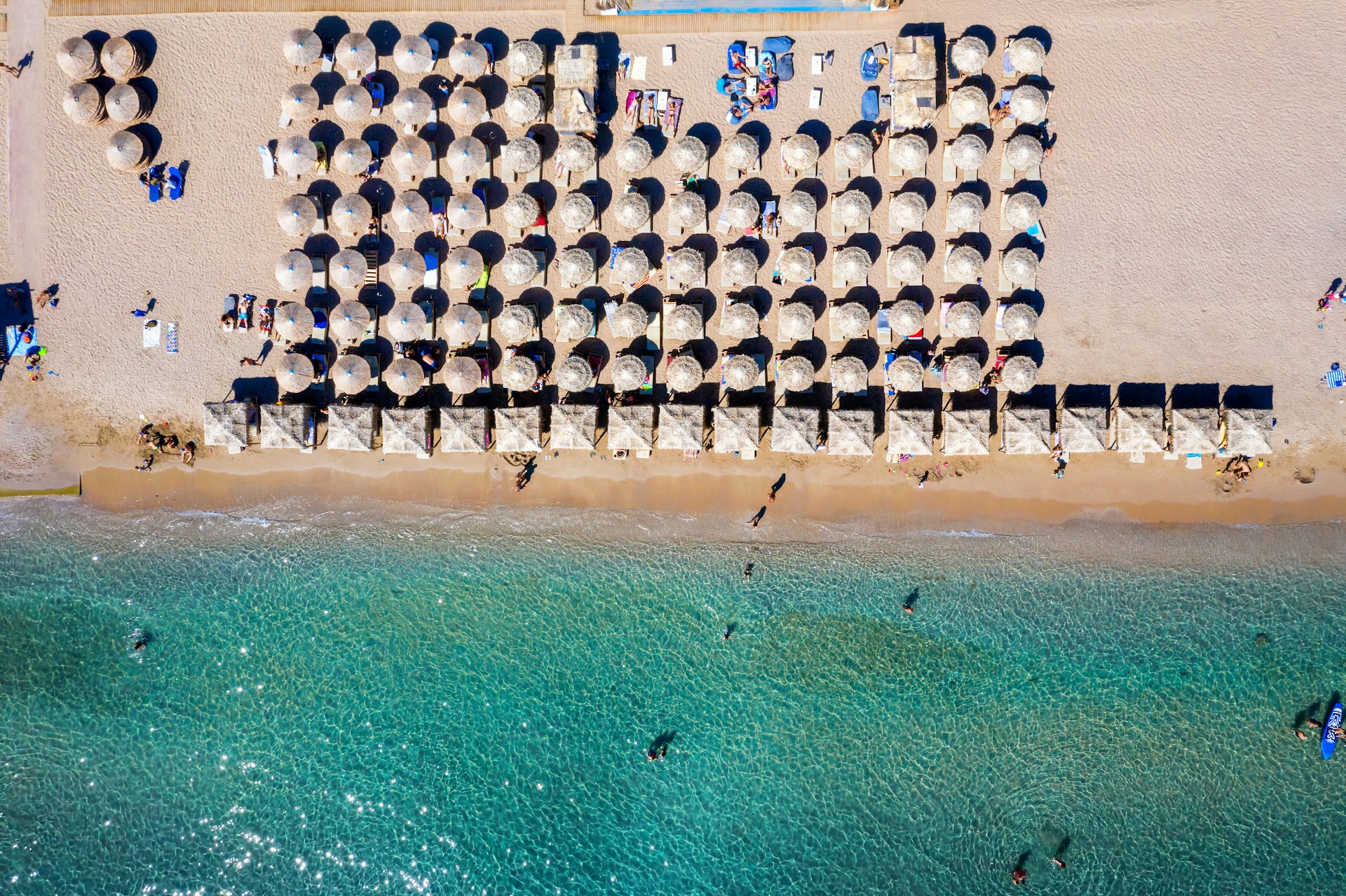 An overhead view of parasols and loungers on Varkiza Beach