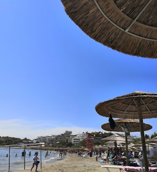 Athens, Greece, August 2021. View of Vouliagmeni beach on a hot summer day
