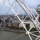 A man dressed as Britain's most famous secret service agent, James Bond, is silhouetted against the London skyline as he climbs the outside of a pod on the lastminute.com London Eye, the landmark tourist attraction in central London, ahead of the world premiere of No Time To Die, the latest instalment in the Bond franchise. Picture date: Tuesday September 28, 2021. (Photo by Steve Parsons/PA Images via Getty Images)