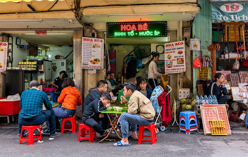 JANUARY 21, 2018: People eating at a street café in the old quarter of Hanoi.