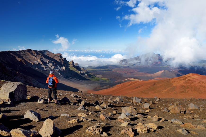A hiker on the Haleakalā volcano crater on the Sliding Sands Trail on Maui, Hawaii