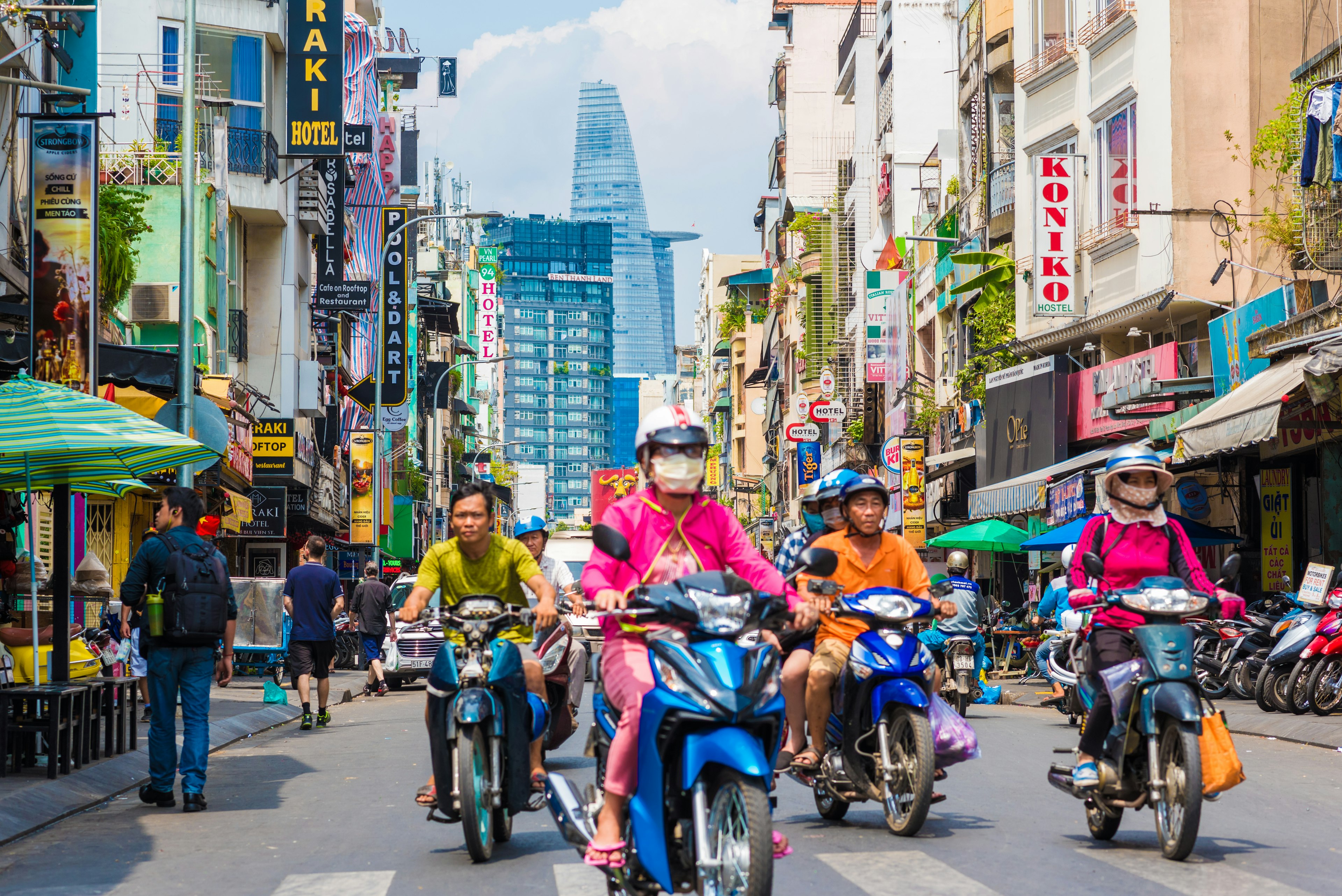 Scooter riders and pedestrians on Bui Vien Street